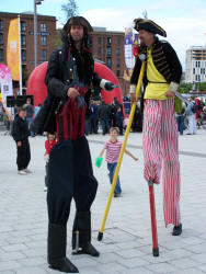 Kris and Pete, pirate stiltwalkers