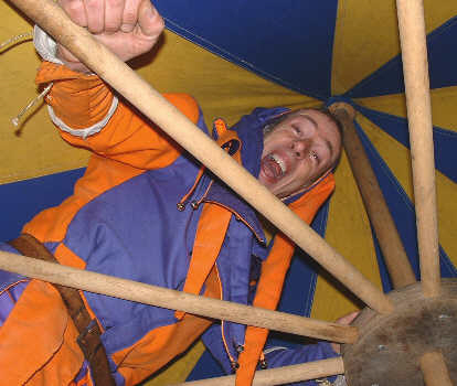 Kris Katchit looks down from the top of a tent.
