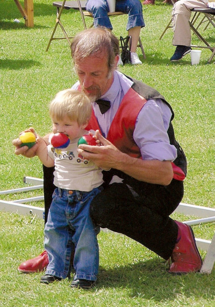 Kris Katchit with a young volunteer during a show